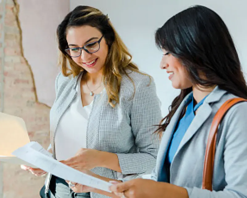 Two women discuss ISO certification